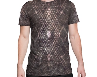 May include: A dark gray t-shirt with a geometric pattern in white and light pink. The pattern is a series of overlapping lines and shapes that create a complex and intricate design.