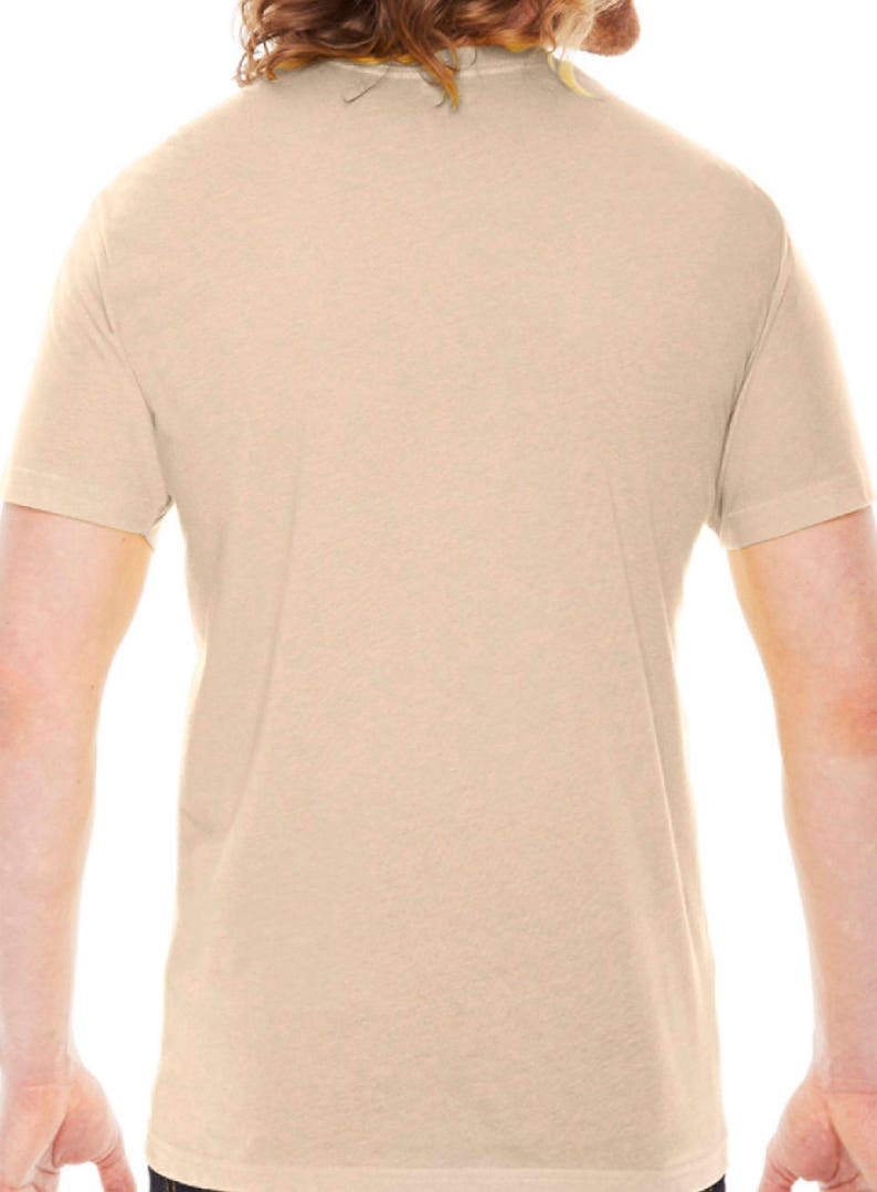 May include: A plain, light beige t-shirt with short sleeves.