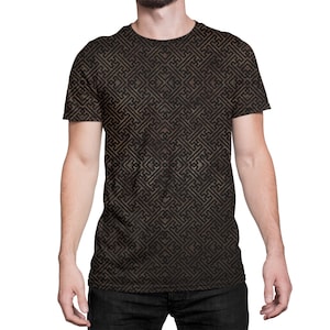 May include: A black t-shirt with a brown geometric pattern. The pattern is made up of repeating squares and lines.