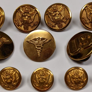 12 assorted Genuine Military Buttons and Pins Offer as a lot.