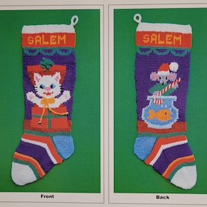 May include: A knitted Christmas stocking with the name "SALEM" on the front. The stocking features a white cat with a red bow holding a gift box on the front and a mouse holding a candy cane and a fish bowl on the back.