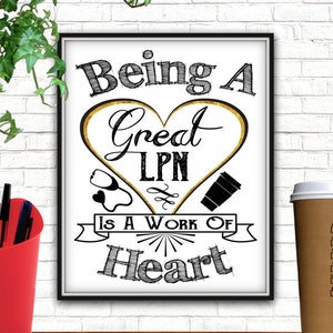May include: A black and white framed print with the text "Being a Great LPN is a work of heart". The text is in a handwritten style and is surrounded by a gold heart with a stethoscope, a coffee cup, and a swirl design.
