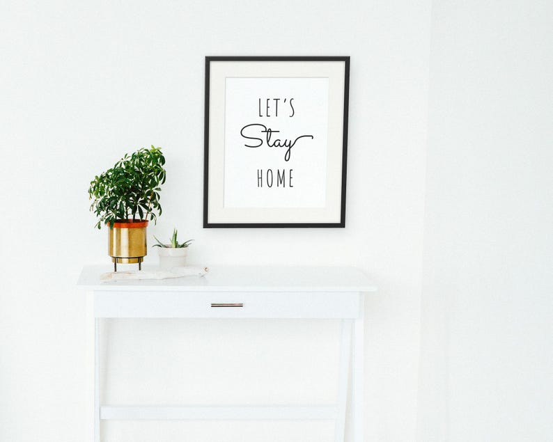 Let's Stay Home framed in a hallway and entry