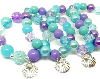 Seashell bracelets party favors in organza bags with a special birthday girl bracelet