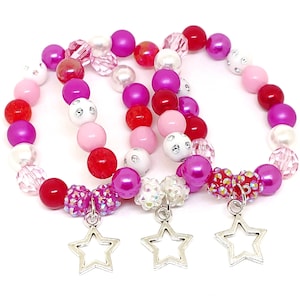 Pulseras de estrella como obsequios para fiestas en bolsitas de organza - Artículos de cumpleaños con estrellas rosas para niñas