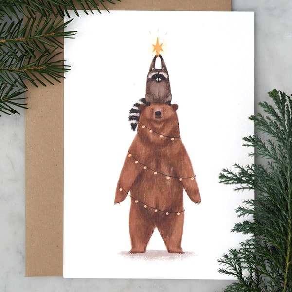 Tarjeta navideña de felices fiestas de oso y mapache