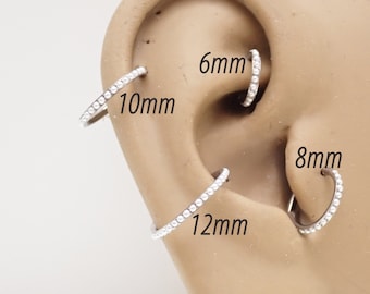 Aro de titanio con perla y clicker: 16 g para tabique, daith, trago y hélix
