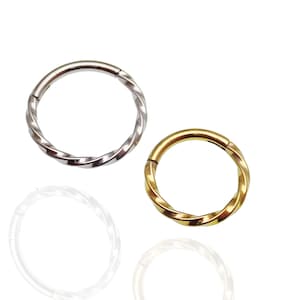 Conception torsadée, cliquet articulé, titane de qualité implant · Septum, hélice, cartilage, tragus, daith, lèvre, nez, tour, lambi externe · 16 g