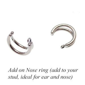 May include: Two silver nose rings, each with a double hoop design. The rings are ideal for adding to a stud earring.