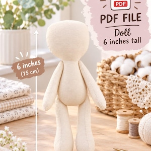 May include: A beige fabric doll with a rounded head and simple limbs, standing 6 inches tall. The image includes text indicating it is a PDF file for a doll that is 6 inches tall, with a visual arrow showing the 6 inches (15 cm) height measurement.