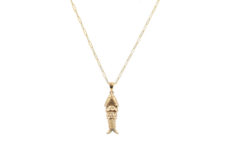 This handmade Gold Filled Fish Necklace is crafted in Belgium, featuring articulated fish design attached on an elegant chain. The design is suitable for different occasions and styles, therefore it is a must for a jewelry box.