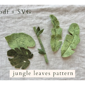 May include: A set of five felt jungle leaf patterns in shades of green. The patterns are labeled ".pdf + SVG" and "jungle leaves pattern".
