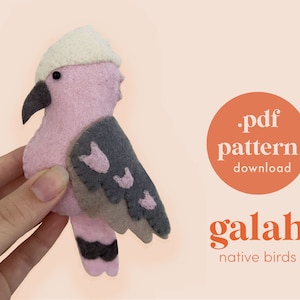May include: A pink and gray felt galah bird plush toy. The toy is being held in a hand. The text on the image reads '.pdf pattern download galah native birds'.