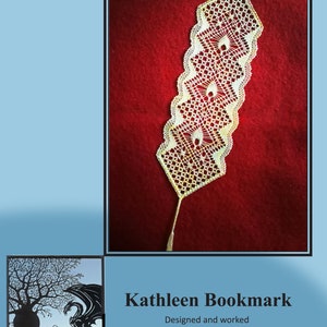 May include: A white lace bookmark with a delicate pattern and a tassel. The bookmark is on a red background. The text "Kathleen Bookmark Designed and worked by Jenny Brandis" is below the bookmark.