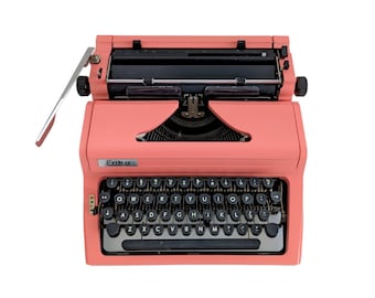 SALE!* Erika Model 100 typewriter, a pink typewriter, a vintage portable desk typewriter from the 1980s with qwerty keyboard.