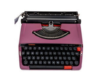 SALE!* Purple Brother Deluxe 250TR typewriter, a good working and vintage typewriter, a smaller ultraportable machine with qwerty.