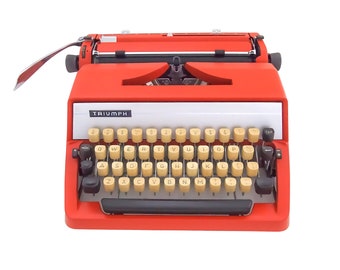 SALE!* A beautiful vintage Triumph Gabriele 25 typewriter, an orange typewriter with a qwerty keyboard, a desk typewriter, 1970s.