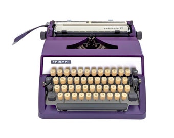 SALE!* Triumph Gabriele 25 typewriter, purple typewriter from Triumph, a working and vintage and portable typewriter with qwerty.