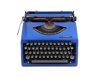 SALE!* Vintage Triumph Tippa typewriter in dark blue purple colour, manual and portable typewriter with qwerty keyboard from 1970s.