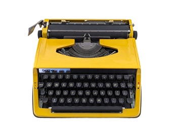 SALE!* Yellow Brother Deluxe 800 typewriter, a good working and vintage typewriter, a smaller ultraportable machine with qwerty.