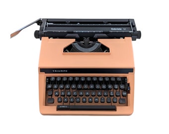 SALE!* Triumph Gabriele 12 typewriter, a salmon pink typewriter with a qwerty keyboard , a bigger modern desk typewriter, A3 typewriter.