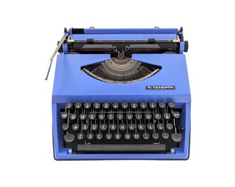 SALE!* Vintage Triumph Tippa typewriter in blue purple colour, manual and portable typewriter with qwerty keyboard from 1970s.