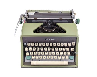 SALE!* Vintage Olympia SM7 typewriter from the 1960s in working condition, mint green colour, manual, qwerty.