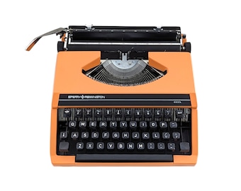 SALE!* Vintage ultra portable Sperry Remington Idool typewriter from the 1970s in good working condition, a peach orange coloured typewriter