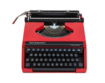 AUSVERKAUF!* Ultraportable Vintage-Schreibmaschine Sperry Remington Streamliner aus den 1970er Jahren in gutem, funktionsfähigem Zustand, originale rote Farbe