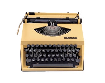 SALE!* A vintage Adler Tippa typewriter, a light yellow vanilla typewriter with qwerty keyboard, a portable typewriter for writing poems.