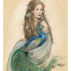 May include: A woman with long brown hair adorned with flowers holds a peacock with its tail feathers spread out behind her. The peacock is blue, green, and gold with iridescent feathers.