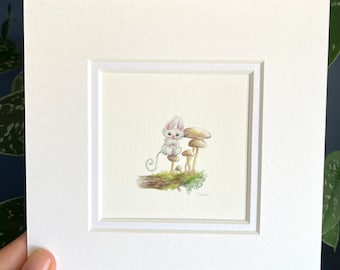 May include: A white rabbit with pink ears sits on a mushroom in a watercolor painting. The rabbit is surrounded by other mushrooms and green foliage.
