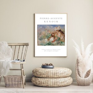 Puede incluir: Una impresi&oacute;n art&iacute;stica enmarcada con una pintura de Pierre-Auguste Renoir. La obra de arte representa figuras en un campo de flores. La impresi&oacute;n incluye el nombre del artista y el t&iacute;tulo de la pintura en franc&eacute;s.