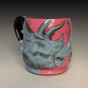 Pink and cobalt triceratops cup