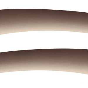 May include: Two brown and beige gradient-colored fabric swatches. The swatches are curved and have a subtle texture.