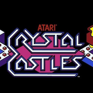 May include: A retro arcade game graphic for Crystal Castles by Atari. The image features a pixelated bear character, enemies, and the game's logo in a vibrant, colorful design. The background is black.