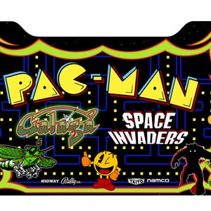 May include: A black arcade game panel featuring the Pac-Man logo in yellow, with the Galaga and Space Invaders logos. The panel has a neon green and yellow border and includes images of characters from the games.