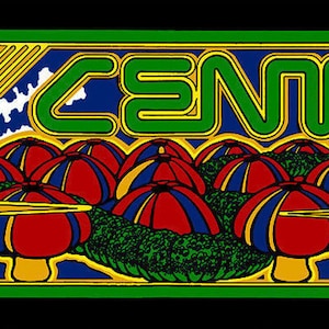 May include: A vintage arcade game panel featuring the word "CENTIPEDE" in green, stylized lettering. The artwork includes a green centipede, red and blue mushrooms, and yellow starbursts, all set against a black background with a green border. The Atari logo is visible.