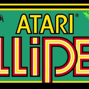 May include: A green and yellow arcade game title card with the text "ATARI" and "MILLIPEDE" in a retro font. The card features a small red spider and green leaves.