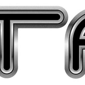 May include: The word "VOLTAGE" in a stylized, three-dimensional font. The letters are outlined in black with a gradient silver fill, creating a metallic effect against a white background.
