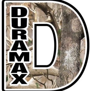 May include: A circular emblem with a black border features the word "DURAMAX" stacked vertically in bold black letters. The background is a camouflage pattern with brown and tan tones, and a large white "D" is on the right.
