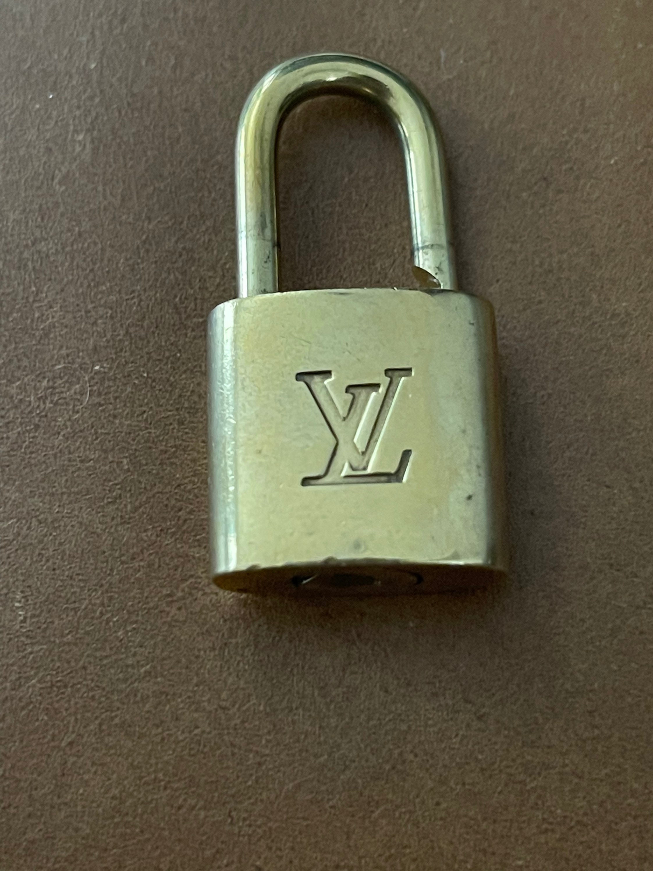 Louis Vuitton 14 k gold plated padlock earrings on hand, Women's