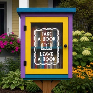 May include: A rectangular wooden community book exchange box featuring a bright yellow door with a glass pane, a purple frame, and a blue roof. The glass displays white text reading "TAKE A BOOK" and "LEAVE A BOOK" with an open book icon.