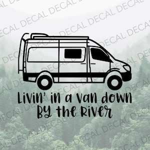 May include: Black and white silhouette of a van with a roof rack and the text "Livin' in a van down by the river".