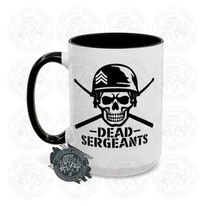 May include: White ceramic mug with a black handle and interior. The mug features a black graphic of a skull wearing a military helmet, crossed batons, and the words "DEAD SERGEANTS" in black.