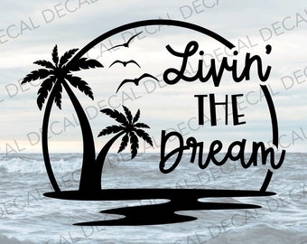 May include: Black and white silhouette design of palm trees and a sunset with the text "Livin' the Dream" in a cursive font.