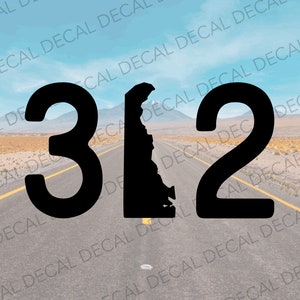 May include: Black and white graphic of the number 312 with the state of Delaware in between the numbers. The graphic is on a road with yellow lines and a desert landscape in the background.