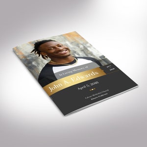May include: A black and gold funeral program with a photo of a smiling man. The program includes the text "In Loving Memory of John A. Edwards", "April 5, 2018", "Calvary Methodist Church", "Manaon California", "1977 - 2010".
