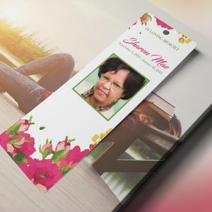 Pink Watercolor Funeral Bookmark Template for Word and Publisher is Size 2.5x7.75 inches. The funeral favor features fuchsia, green, and pink watercolor flowers combined with decorative text. Geared for memorial or funeral services.