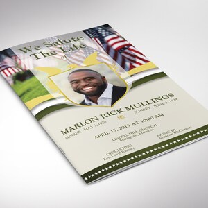 May include: A funeral program with a photo of a man in a gold frame. The program has a green, white, and gold color scheme with a patriotic theme. The text reads "We Salute The Life of Marlon Rick Mullings, Sunrise May 3, 1970, Sunset June 3, 1924, April 15, 2015 at 10:00 AM, Lindell Hill Church, Minneapolis, Minnesota, Officiating Rev. David Ramsey, Music by Marlene McGoman."